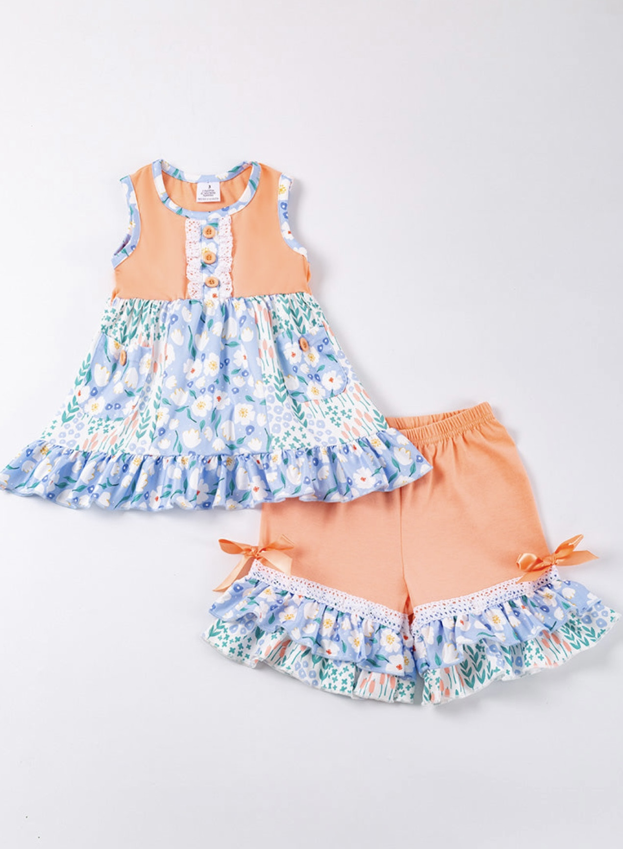 Peach coloured floral print ruffle girl set